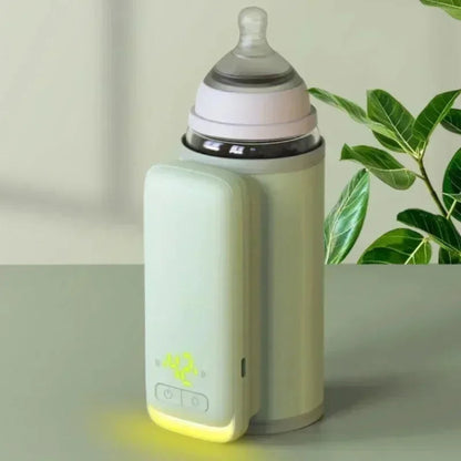 Chauffe-biberon portable vert allumé bien posé 