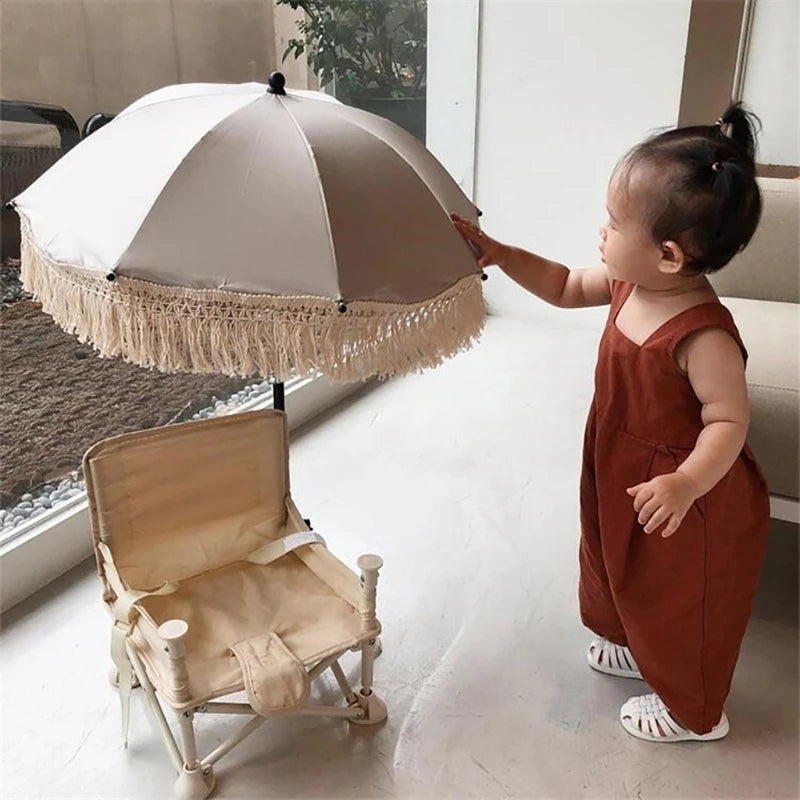 Ombrelle pour poussette A touché par l'enfant au salon